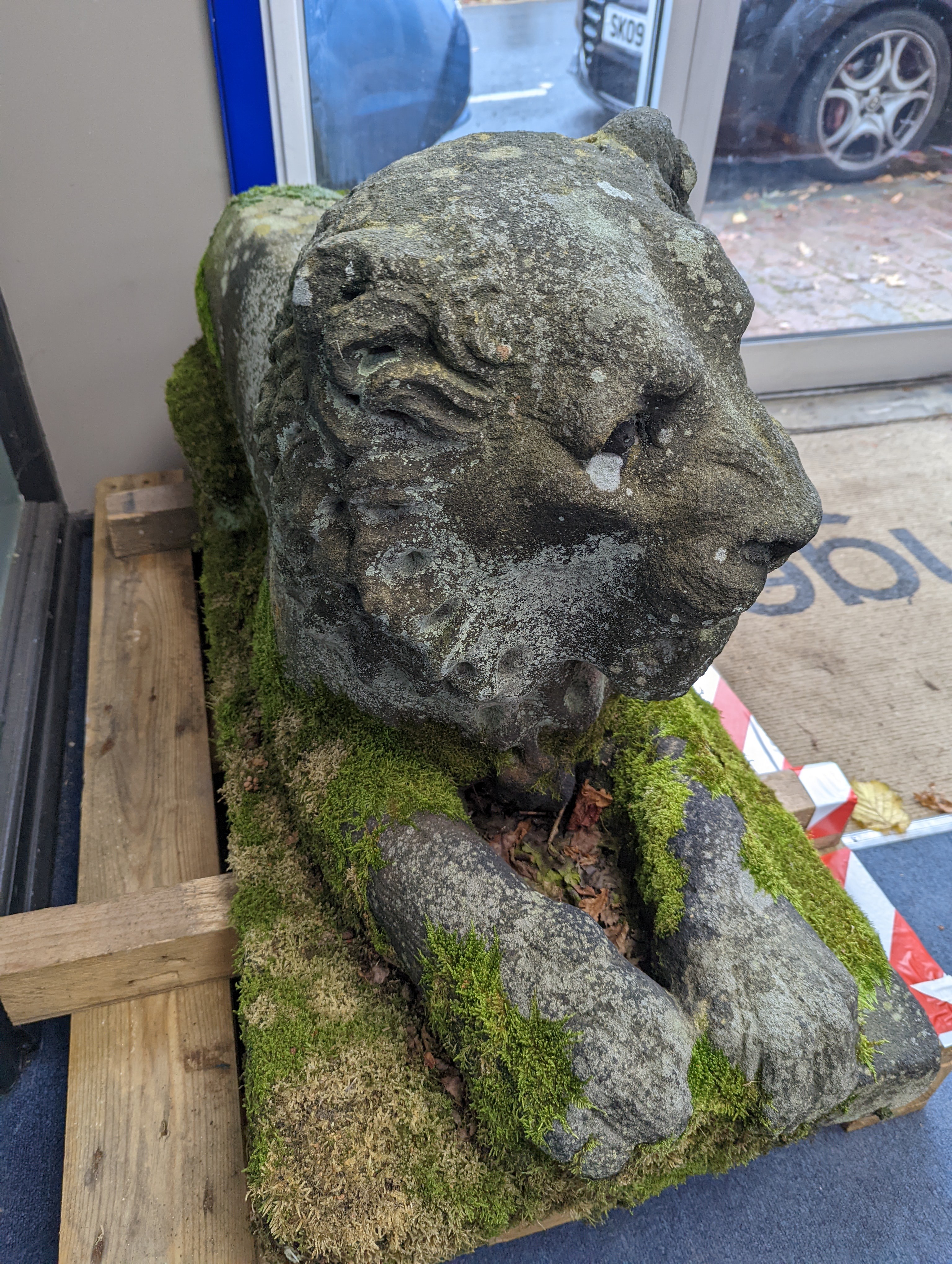 A pair of carved stone models of a recumbent lion and lioness, purchased from Crowther of Syon Lodge approximately 40 years ago. Length 122cm. Width 50cm. Height 60cm.